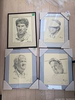 Four framed autographed golfer prints by William Van Zandt arranged on floor, showing style, framing and artist signatures