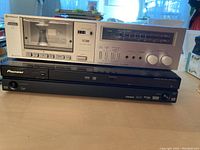 Front view of Hitachi cassette tape deck and Pioneer HDD/DVD recorder stacked