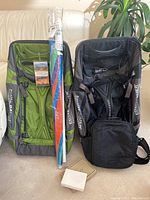 Full lot with two Eddie Bauer bags, umbrella, Pacsafe satchel and wallets