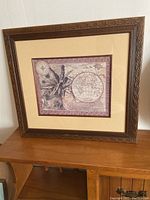 Framed nautical print with dark brown wooden frame and beige mat, vintage map with nautical theme, 15" by 13" size