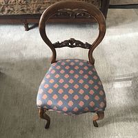 View of the chair from above showing rounded backrest and patterned upholstered seat