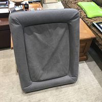 Overall full view of the gray rectangular memory foam dog bed showing the raised edges and cushioned center.