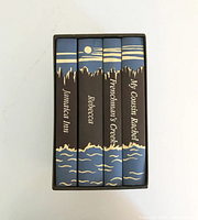 Top view of four books in slipcase showing spines with titles: Jamaica Inn, Rebecca, Frenchman's Creek, My Cousin Rachel.