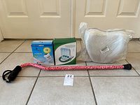 Photo showing all four items together: adjustable walking cane, Pedi-Vac box, incentive spirometer box, and contour leg pillow in plastic packaging.