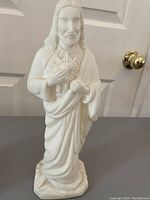 Full view of the 7.5 inch white Jesus statue made of porcelain or ceramic showing detailed robe and facial features.