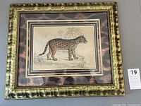 Framed picture of an ocelot illustration with a detailed mat and animal print style frame.