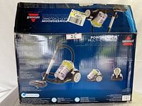 Box of the Bissell PowerGroom Multi-Cyclonic vacuum cleaner showing product details and image