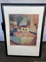 Framed Paul Klee print showing the artwork with two dromedaries and one monkey in abstract colorful blocks.