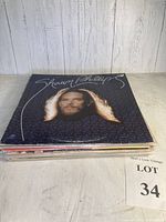 Side view of stacked vinyl albums highlighting Shawn Phillips album on top