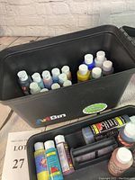 Open ArtBin container showing multiple acrylic paint bottles inside