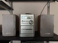 Front view of full Sharp XL-35 stereo system with main unit centered between two speakers.