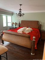 Full view of bed frame with headboard and footboard installed in room