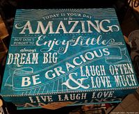 Blue decorative box with motivational phrases in white text