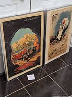 Two framed vintage Italian automobile posters side by side showing Ansaldo and Fiat cars