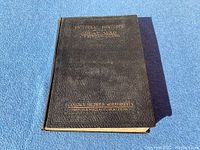 Closed view of black hardcover book titled 'Pictorial History of the Great War 1914-1918' with gold text.