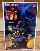 Front cover of the Batman Judge Dredd Judgment on Gotham comic book showing Batman and Judge Dredd characters in action artwork.