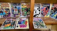 Lot of 11 Fantastic Four comics spread out on display shelf. Includes mix of annuals and regular series from 1980s.