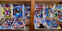 Photo of Marvel 'What If...' comics displayed on shelves and table, showing front covers of ten different issues.