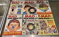Lot of 7 Vintage Mad Magazine Special Issues showing covers with cartoon art and titles