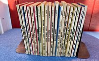 Side view of vintage Archie Comics Digest collection showing the spines of 19 comic digests from the 1960s.