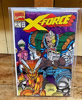 Front cover of the X-Force #1 comic book showing multiple characters with the X-Force logo.
