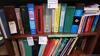Bookshelf with assorted clinical medicine books tightly packed including titles and binders distinctively marked Clinical Medicine Books and Dynamic Differential Diagnosis.