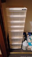 Full view of the seven drawer plastic storage unit showing the overall size and design.
