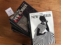 Stack of The New Yorker magazines from 2021 with visible cover artwork and a lot tag