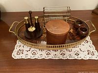 Full view of the brass serving tray with items arranged on top
