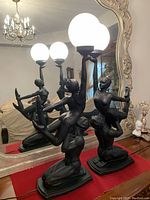 Front view of both lamps on console table in front of mirror