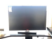 Front view of Dell 30-inch monitor powered off, showing screen and stand.