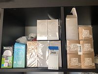 Shelf showing all LED lightbulb boxes including GMY and MaxLite brands in unopened packaging.