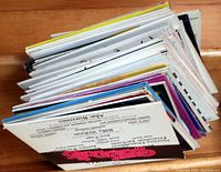 Top down view of stack of vintage Broadway and musical vinyl album covers showing edges and corners of various albums