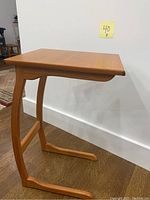 Side view showing C-shaped base and tabletop