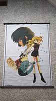 Full view of first anime wall scroll poster showing a male character holding a pocket watch and a blonde female character with bubbles
