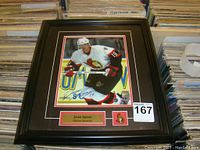 Framed signed 8x10 Jason Spezza Ottawa Senators print, showing player in action on ice, with signature and nameplate in frame.