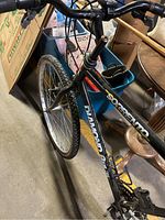 Front and top view of black Diamondback Sorrento mountain bike showing frame and front tire.