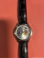 Close-up of Mickey Mouse watch face showing the character and the design details