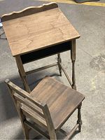 Overview of wooden children's desk and chair set, showing natural wood finish and overall condition.