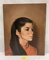 Full frontal view of the oil painting of the young lady in profile, showing artist's signature.