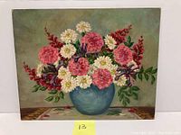 Full view of the oil painting showing floral bouquet in blue vase on a table, signed by artist