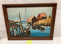 Full image of framed oil painting showing harbor, boats, boat houses, and wooden dock.