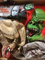 Group of four assorted latex horror masks