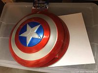 Child-size Captain America shield featuring iconic red, white, and blue star design