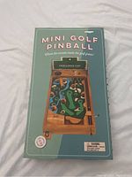 Box front of the Mini Golf Pinball Game showing the full game board design and title.