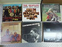 Six LP covers: Beatles Sgt. Pepper's, Beatles Long Tall Sally, Janis Joplin Greatest Hits, Crosby Stills & Nash, John Coltrane A Love Supreme, Sade Diamond Life