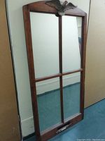 Front view of the full sash window frame mirror showing the four pane design and the decorative eagle at the top, wood frame visible.