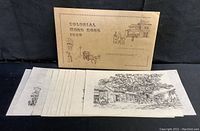 Set of 12 pen and ink sketches displayed with the folder labeled 'Colonial Hong Kong 1850'. The folder appears to be the original packaging for the prints.