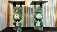 Front view of both frog stands side by side