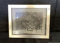 Framed black and white abstract art titled 'Only the King Wears the Crown' with visible frame wear